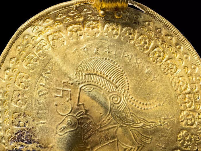 A solid gold swastika disc is the oldest-known reference to Odin of Valhalla, the Norse god of war and death, say archaeologists