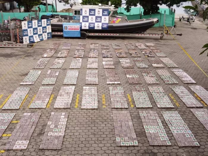 Photos show Colombian authorities unloading 5,800 pounds of cocaine from a submarine captured in the Pacific