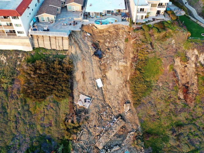 Heavy rain and landslides in California left part of a backyard swimming pool hanging off the edge of a cliff