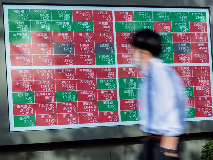 Asian shares ended lower after Switzerland's UBS seals deal to acquire Credit Suisse