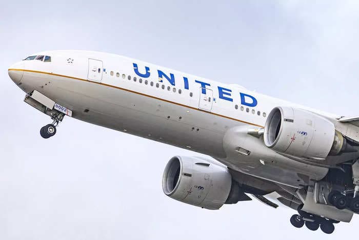 United Airlines crew reported 'a possible fire' in a plane's engine, causing the aircraft to turn around, FAA says