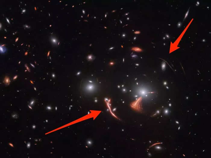 New James Webb telescope photo of a galaxy cluster 6 billion light years away shows a trippy phenomenon where gravity warps spacetime