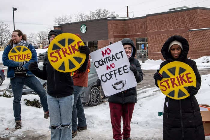 Starbucks union is using billboards, a brass band, and a butter sculpture to pressure board members from Nike, Land O'Lakes and Lego