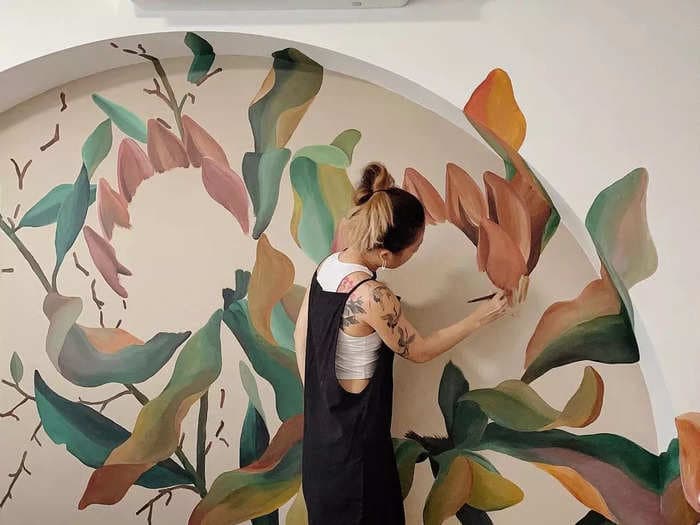 How a former art teacher makes a living painting murals in strangers' homes in one of the world's most expensive cities