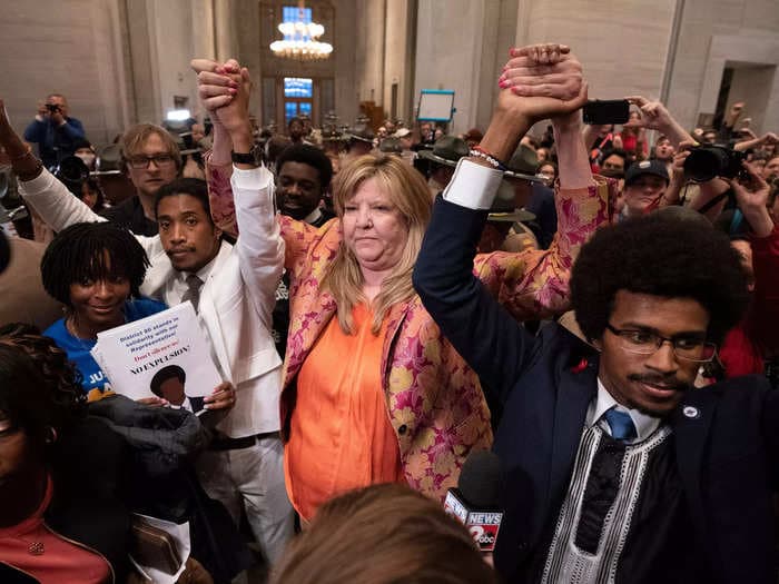 A white Tennessee lawmaker survived expulsion while 2 young Black lawmakers lost their seats for protesting gun violence. She says the result 'might have to do with the color of our skin.'