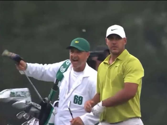 Masters leader Brooks Koepka escaped a 2-stroke penalty after his caddie appeared to give advice to an opponent