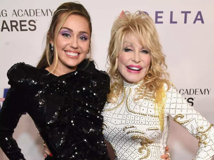 A Wisconsin teacher is on administrative leave after complaining that her school banned Dolly Parton's 'Rainbowland' from a student performance