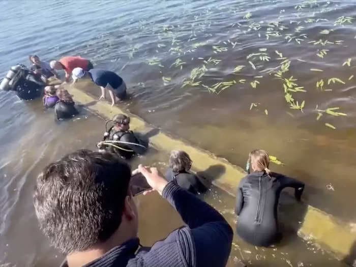 WATCH: A nearly 1,000-year-old Native American canoe discovered by a group of 13-year-old boys was excavated from a North Carolina lake