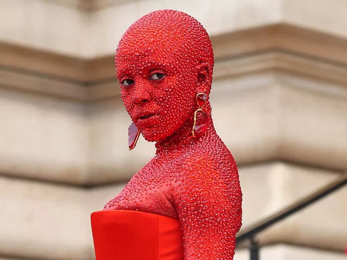 Doja Cat says she was 'super ill' while wearing her viral red Swarovski crystal suit at Paris Fashion Week: 'My stomach felt like there was a blade in it'