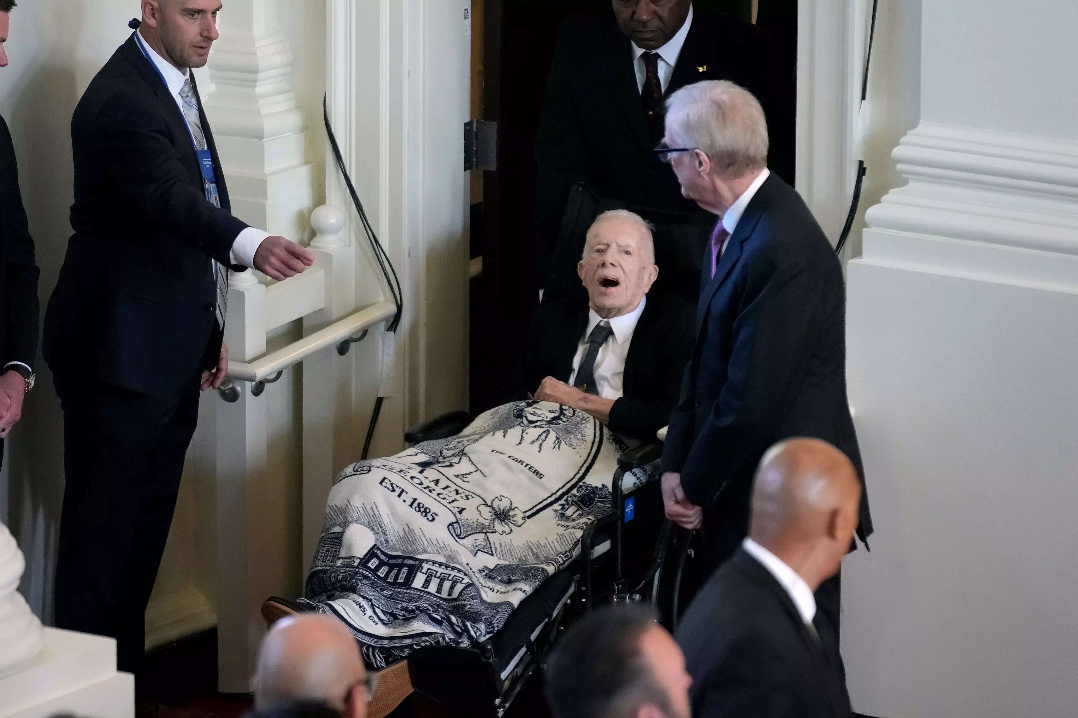 President Jimmy Carter wore a blanket with his late wife Rosalynn