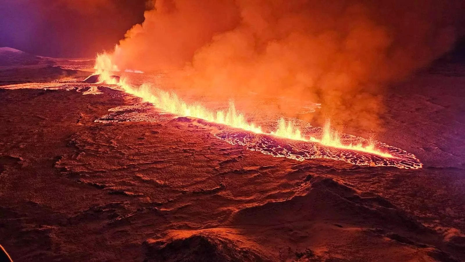 Take a look at the rivers of lava flowing out of a fissure caused by ...