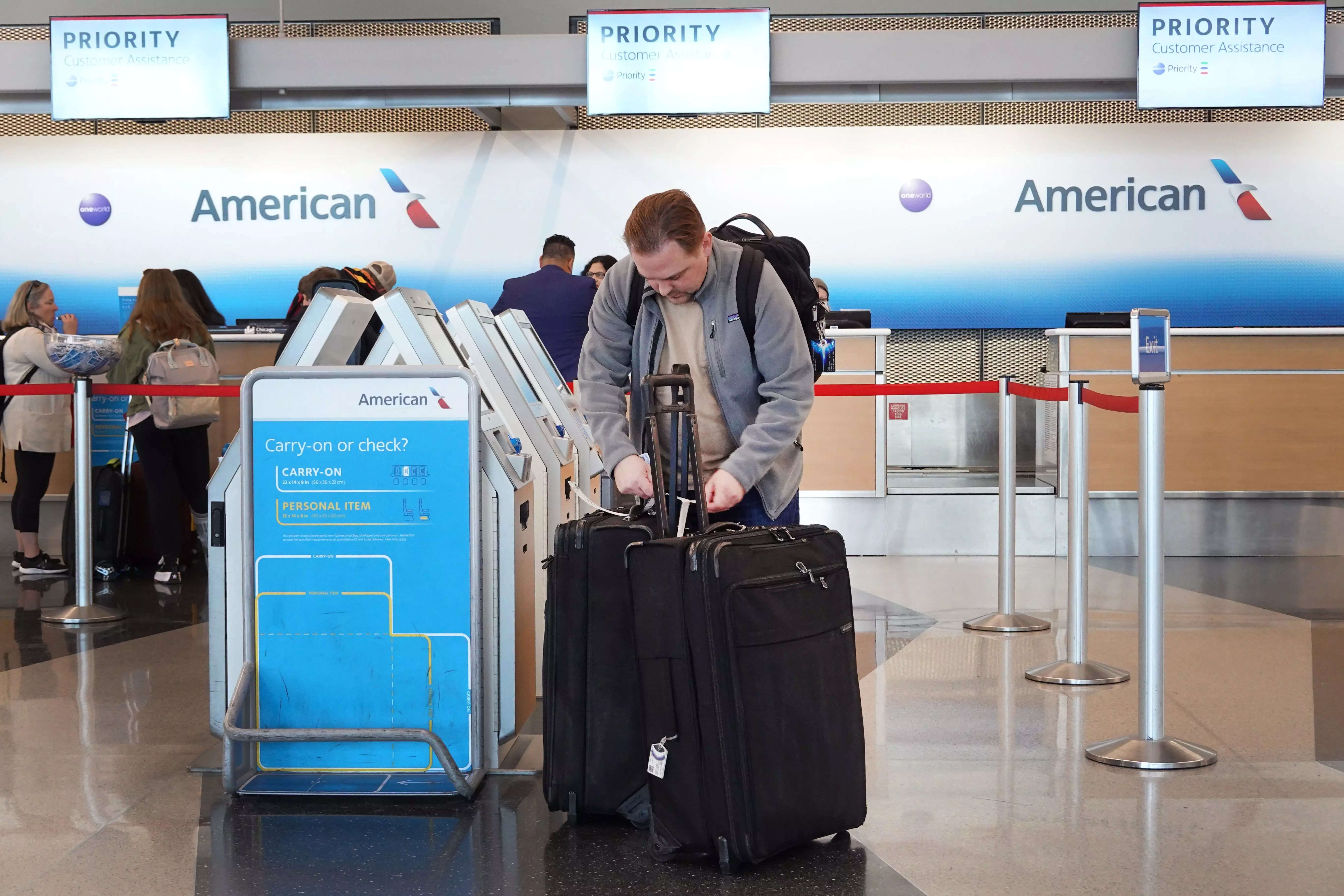 Cost for checked baggage on american airlines on sale