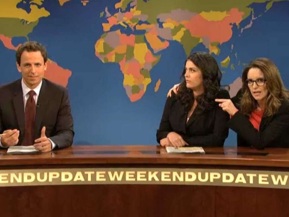 Tina Fey Aaron Paul Drunk Uncle And New Co Anchor Appear In Snls Weekend Update 