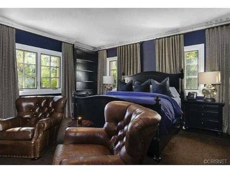Another Bedroom Has Luxurious Purple And Leather Decor