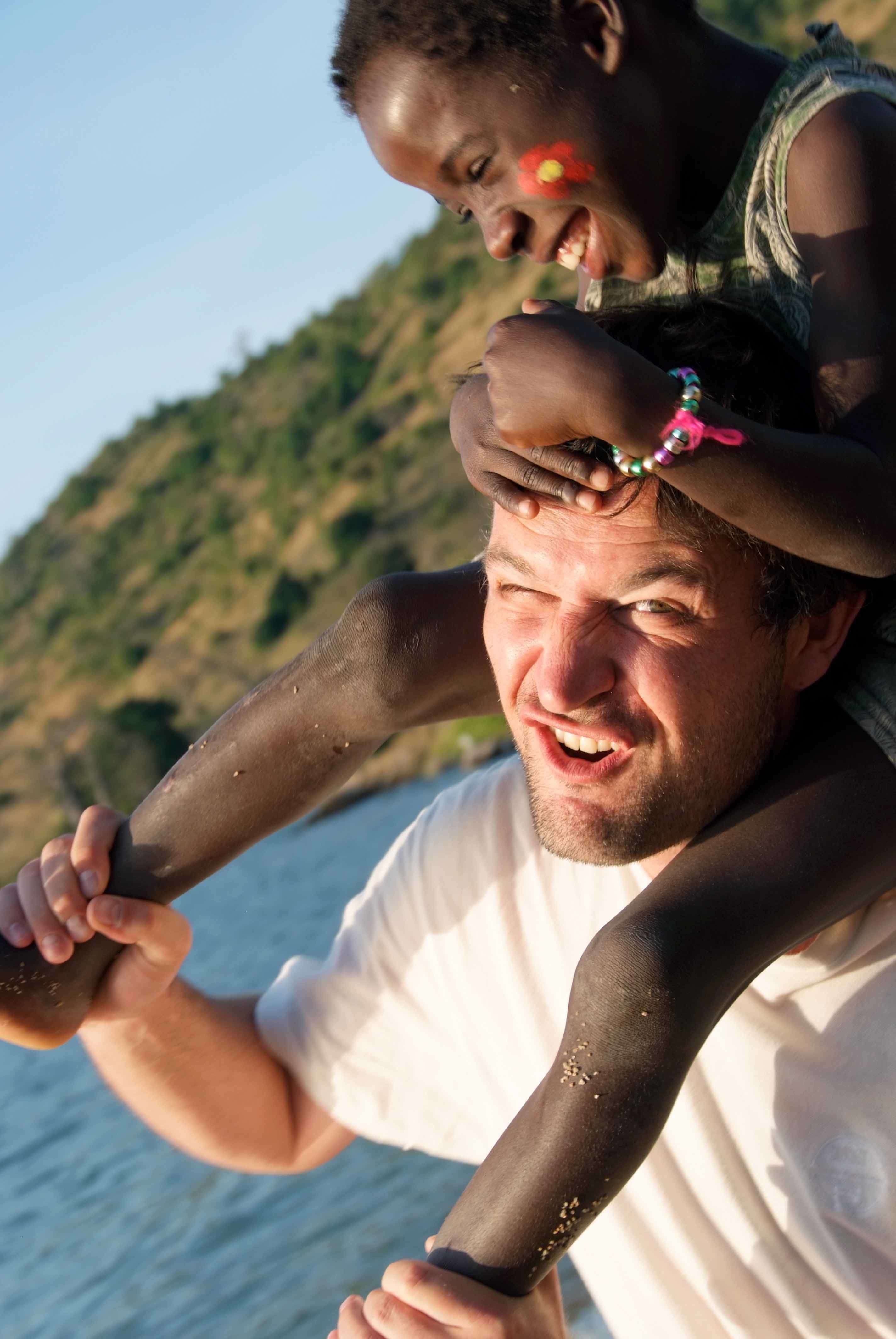 A young boy smiling in his Brazil T shirt. Likoma Island, Lake