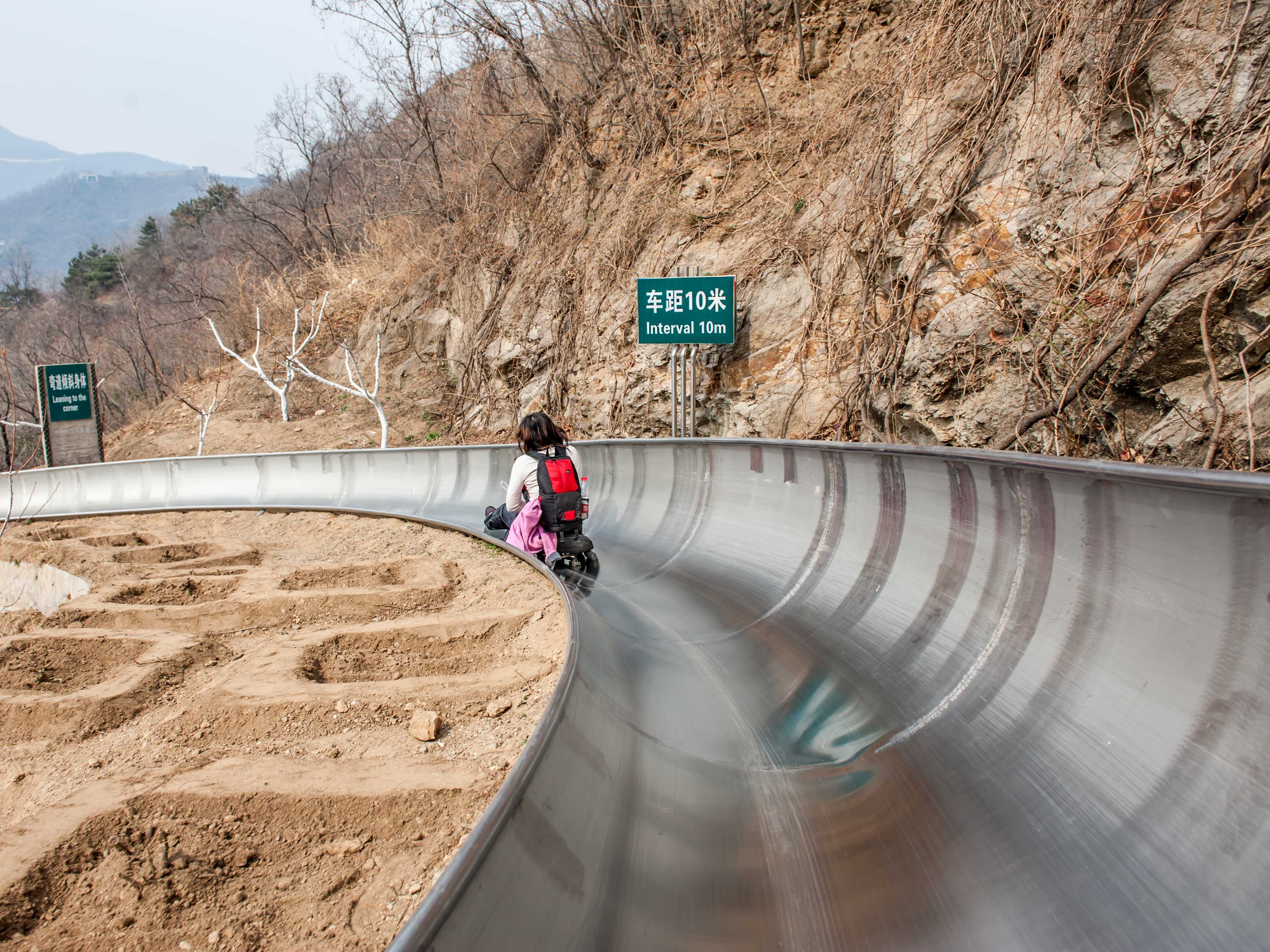 Slide down the Great Wall of China on the 5,184-foot-long toboggan run ...