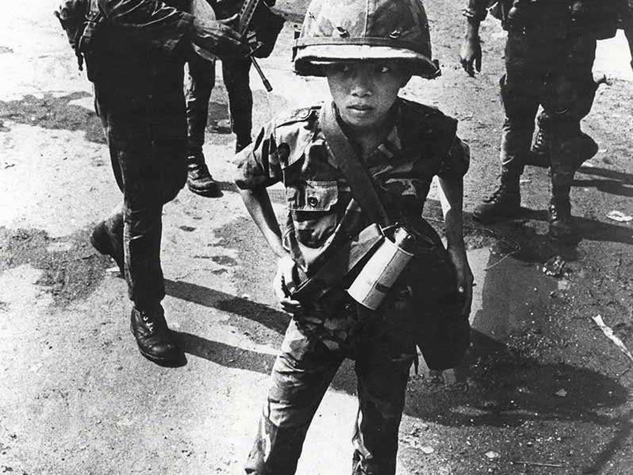 This child soldier, captured in a photo by war photographer Philip ...