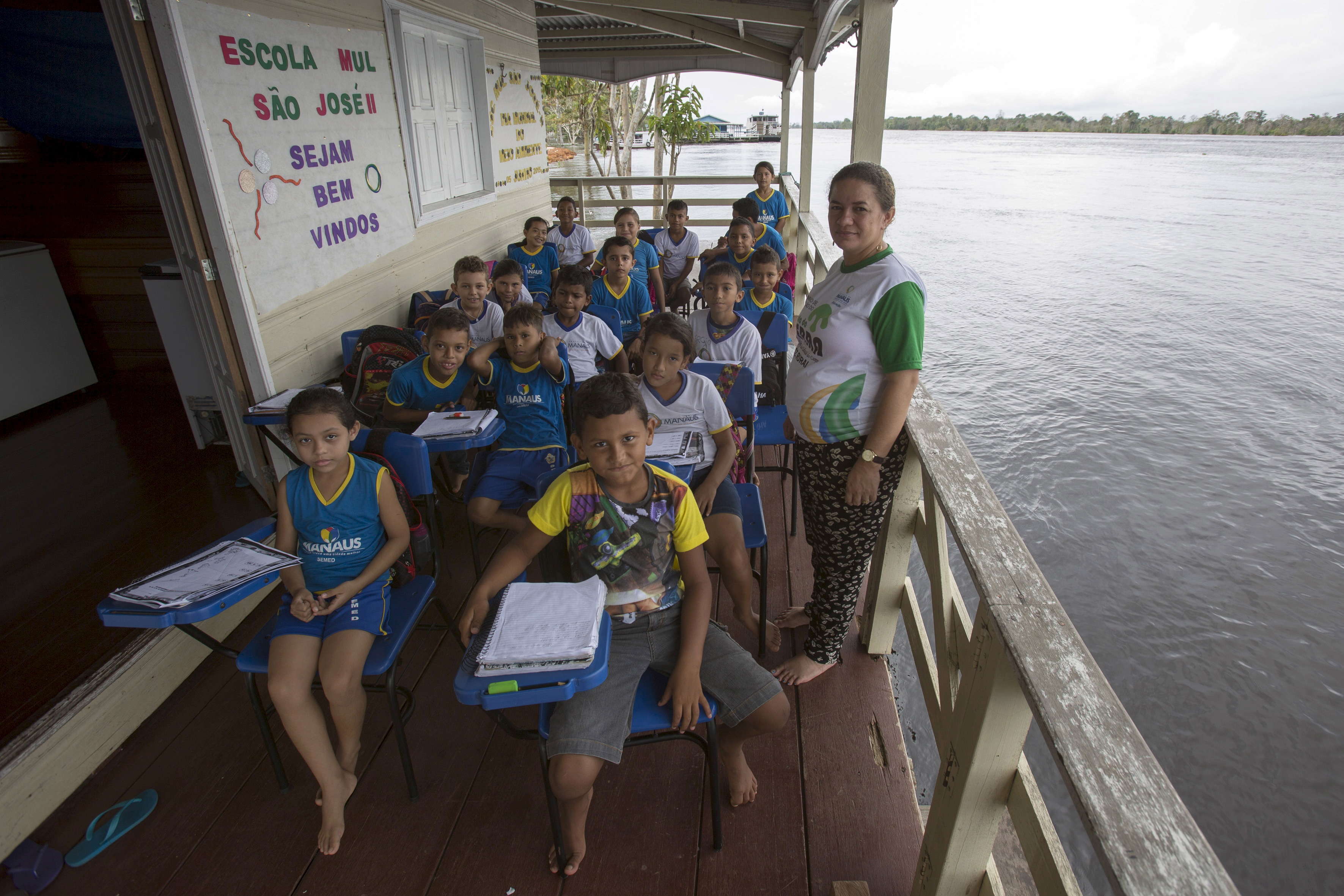 These kids have class on a floating school boat called Municipal School