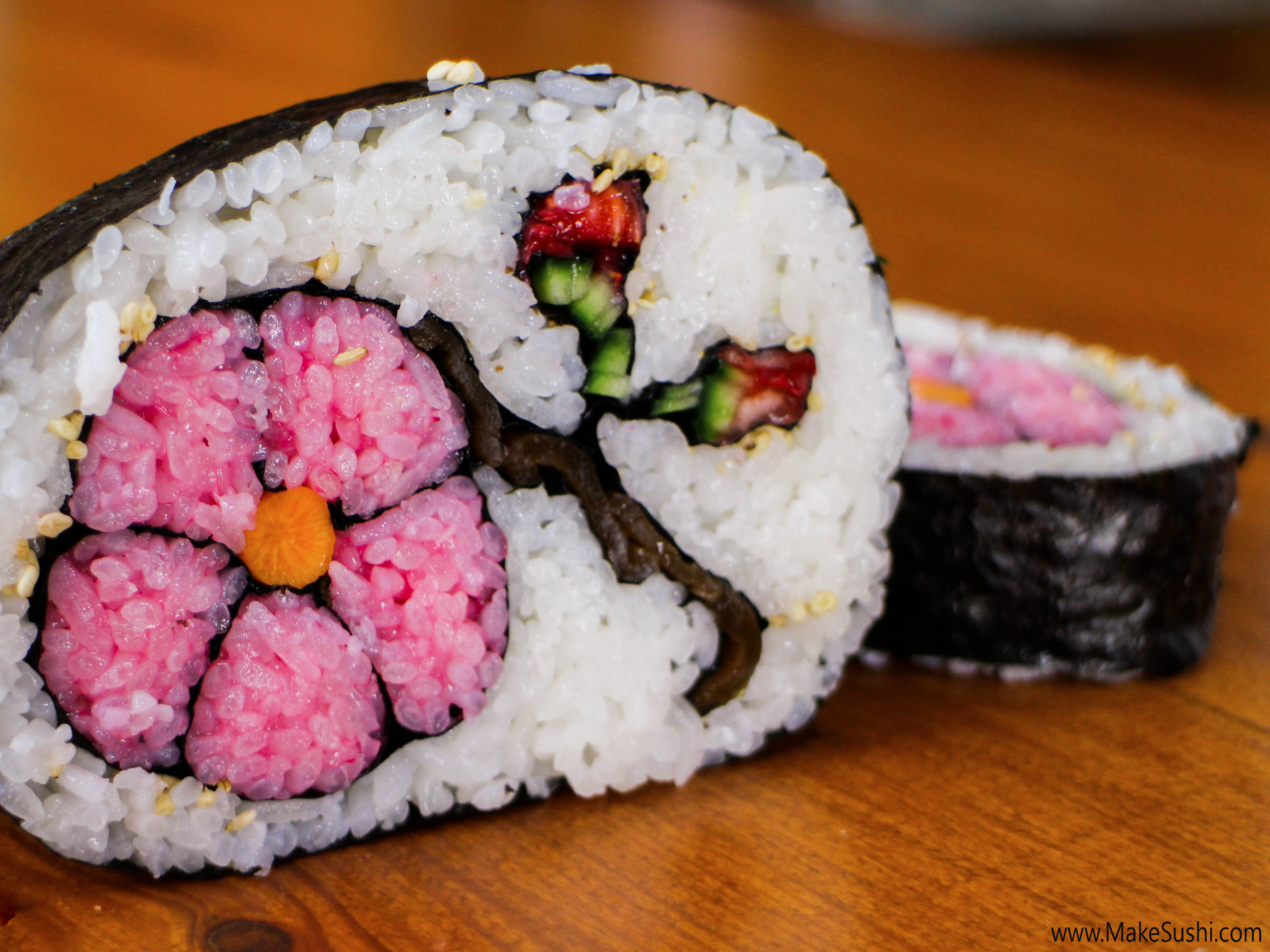 https://www.businessinsider.in/photo/50116276/One-of-the-only-rolls-to-include-fruit-this-flower-sushi-roll-features-minced-strawberries-and-rice-thats-been-made-pink-with-raspberries-.jpg