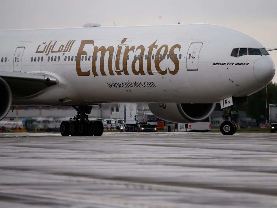 An Emirates flight attendant dies after falling out of a Boeing 777 ...