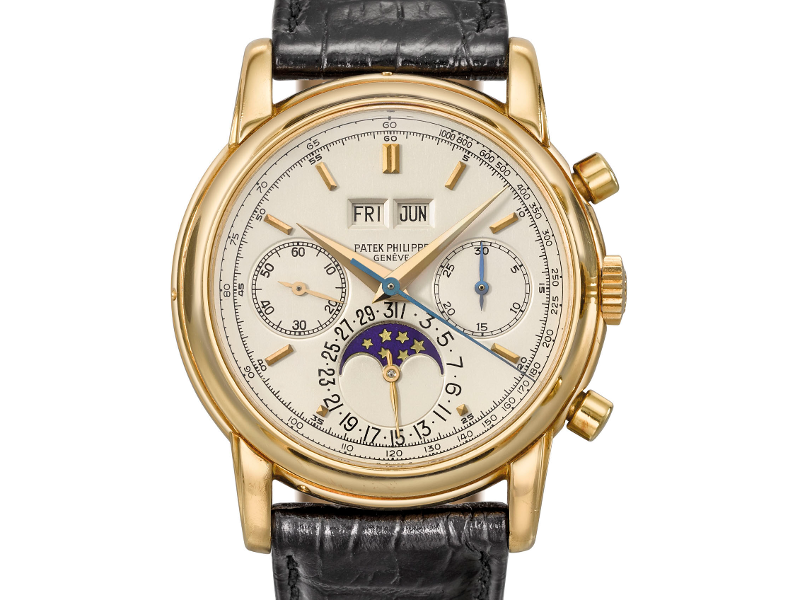 8. This Patek Philippe 18K gold perpetual calendar chronograph watch ...