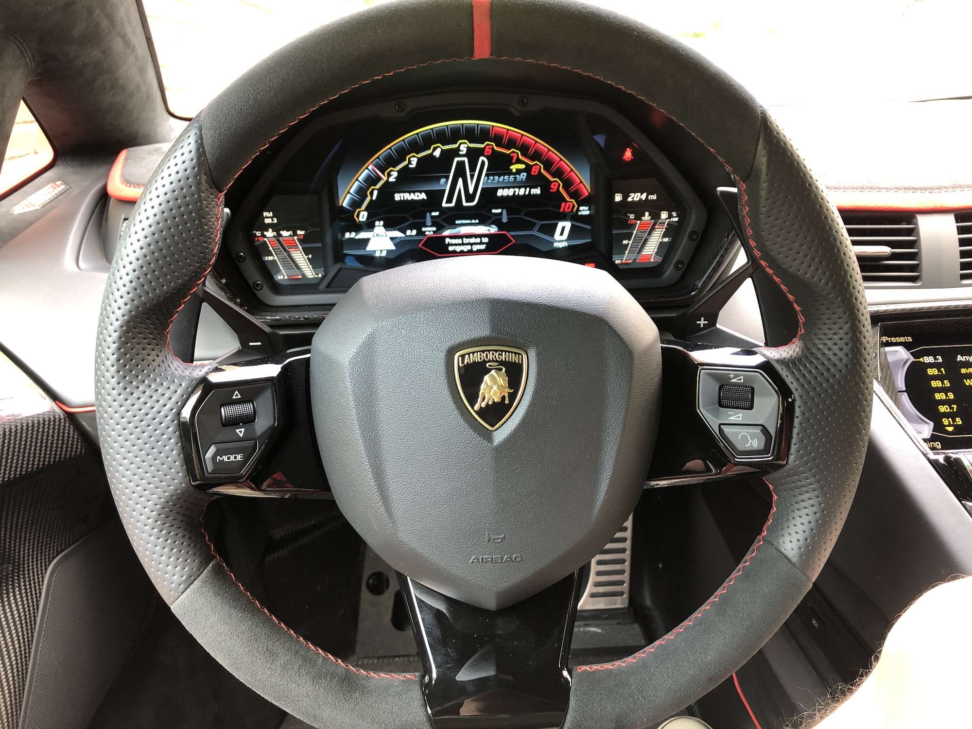 The Aventador’s steering wheel is Alcantara and perforated leather