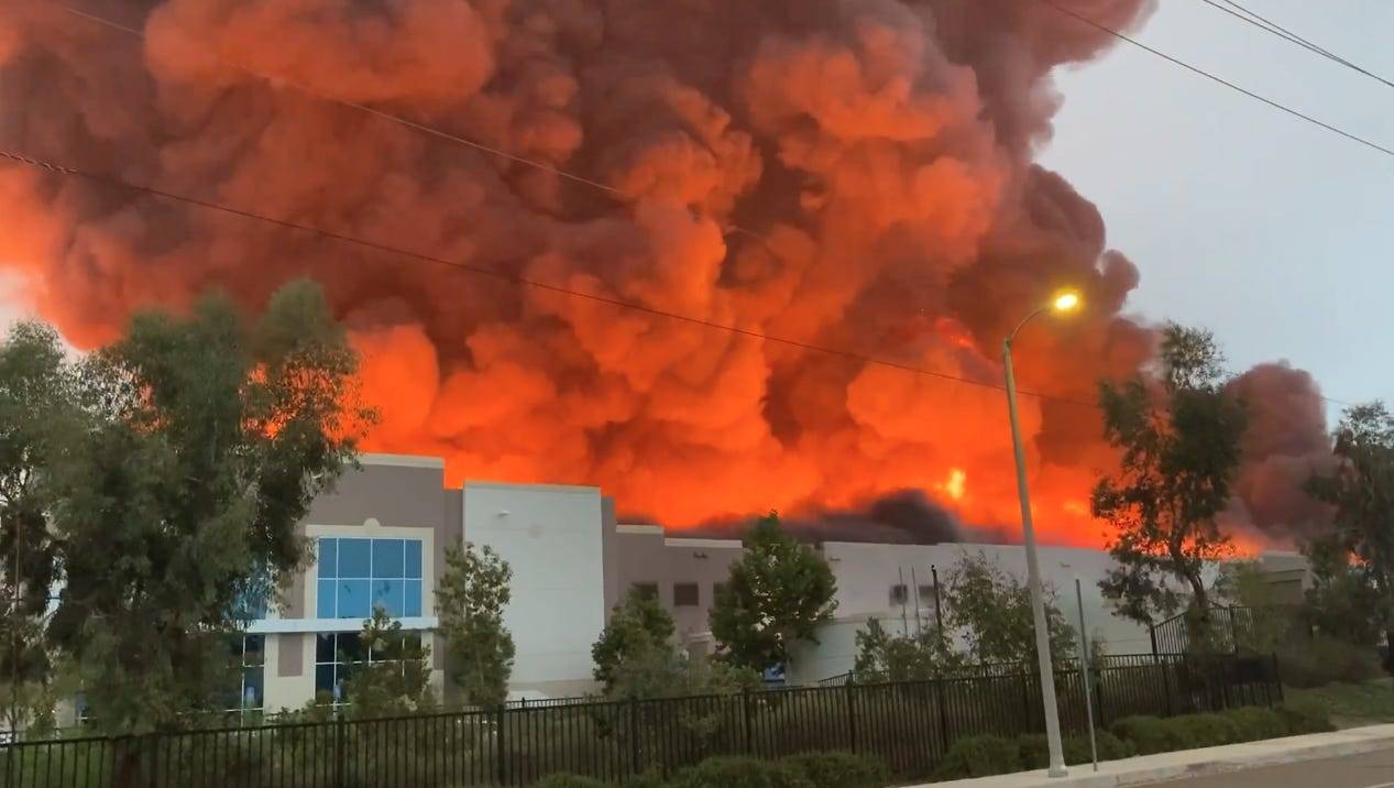 Amazon trucks burn as a massive fire tears through a California