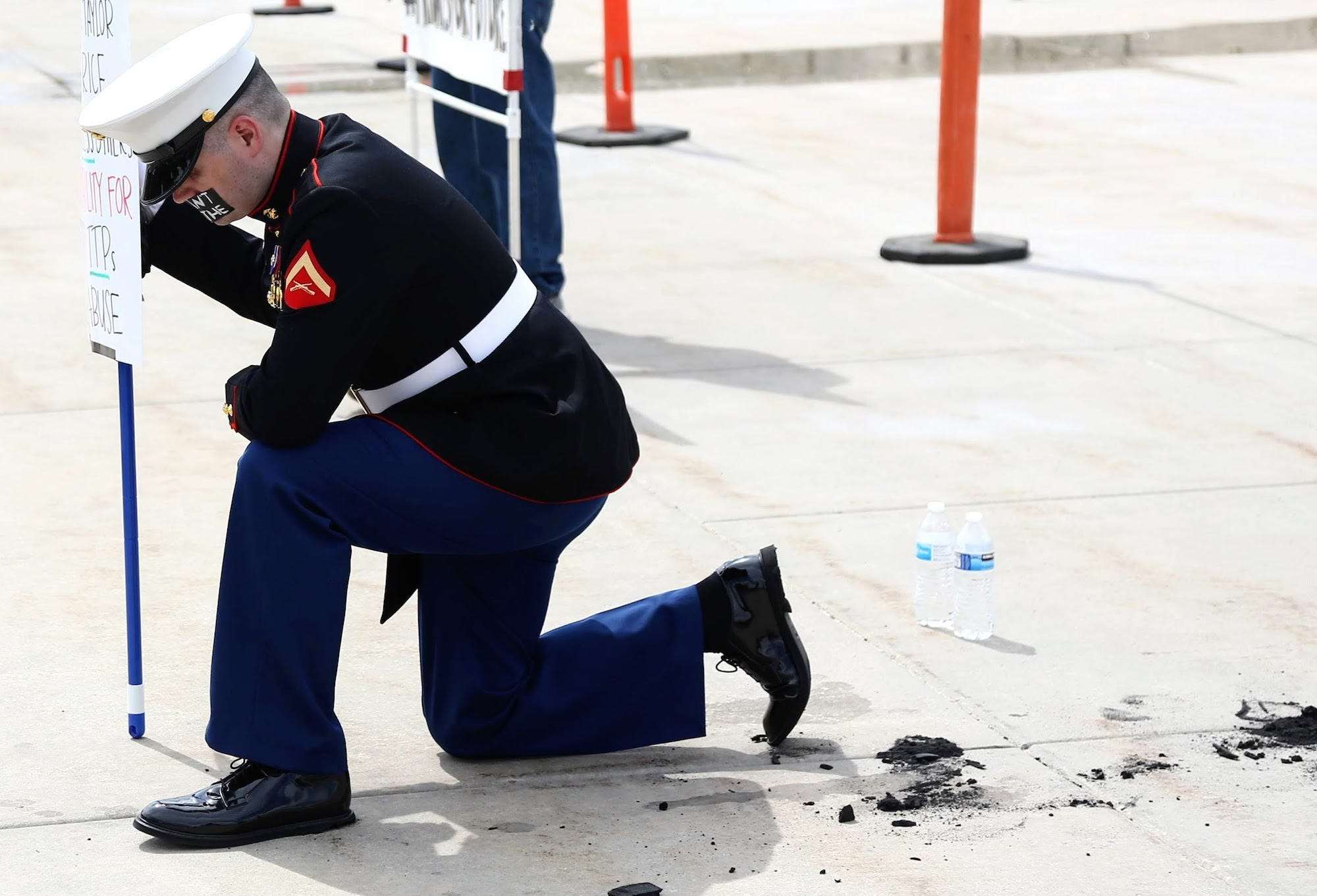 Photos: Utah Marine veteran stands alone at Capitol with 'I can't breathe'  covering mouth