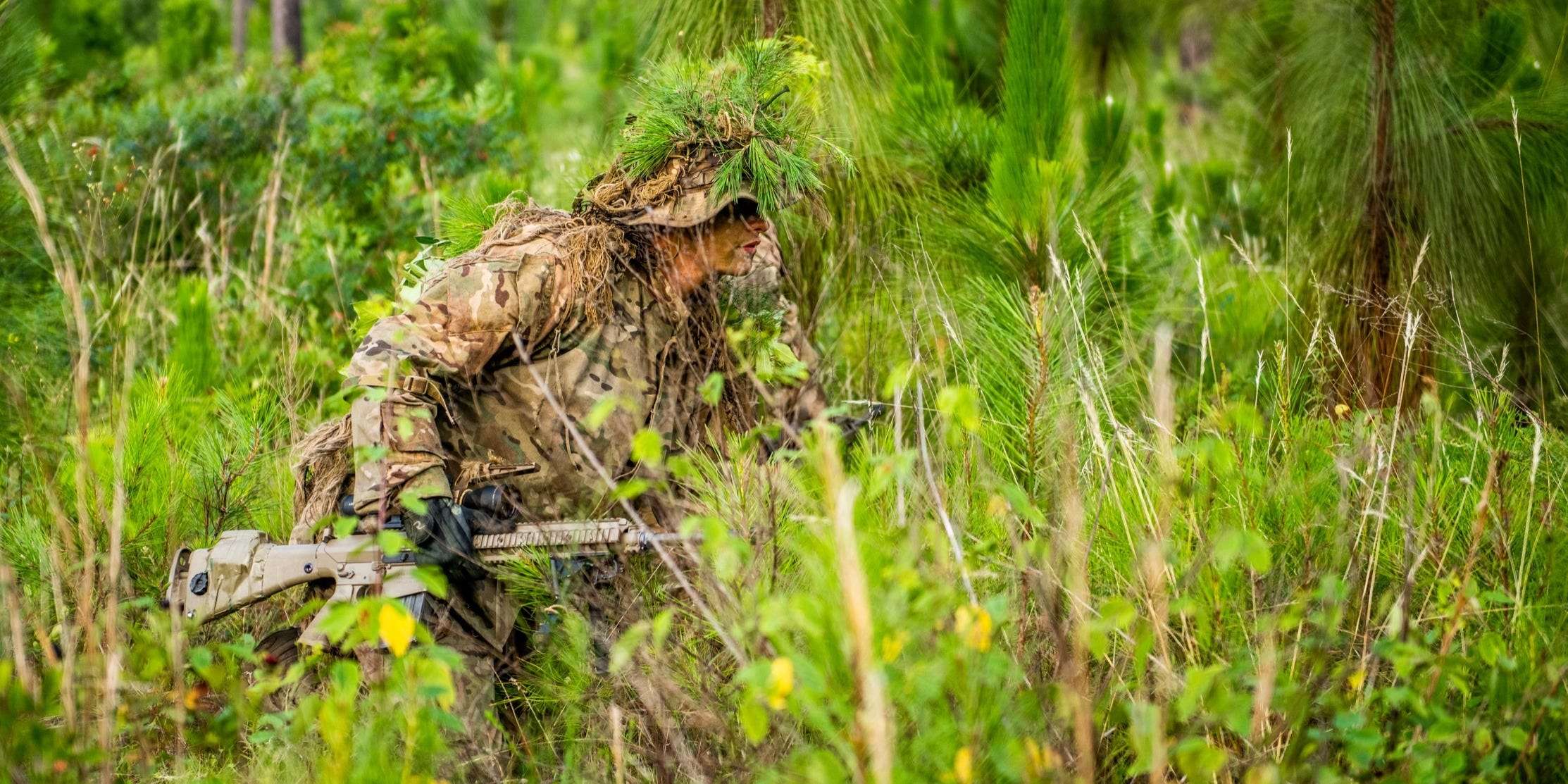 PHOTOS: US Army soldiers become part of the forest as they learn to be ...