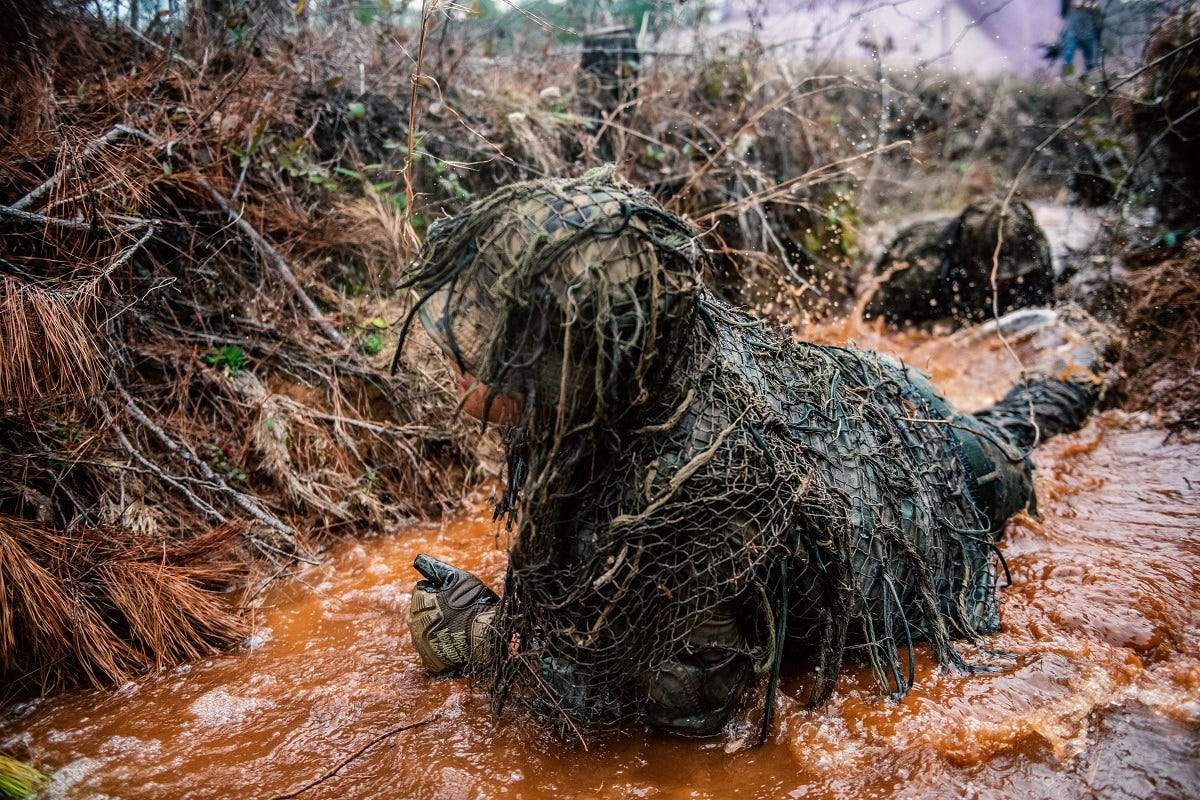 Mastering camouflage is a dirty job for US snipers, and these wild ...