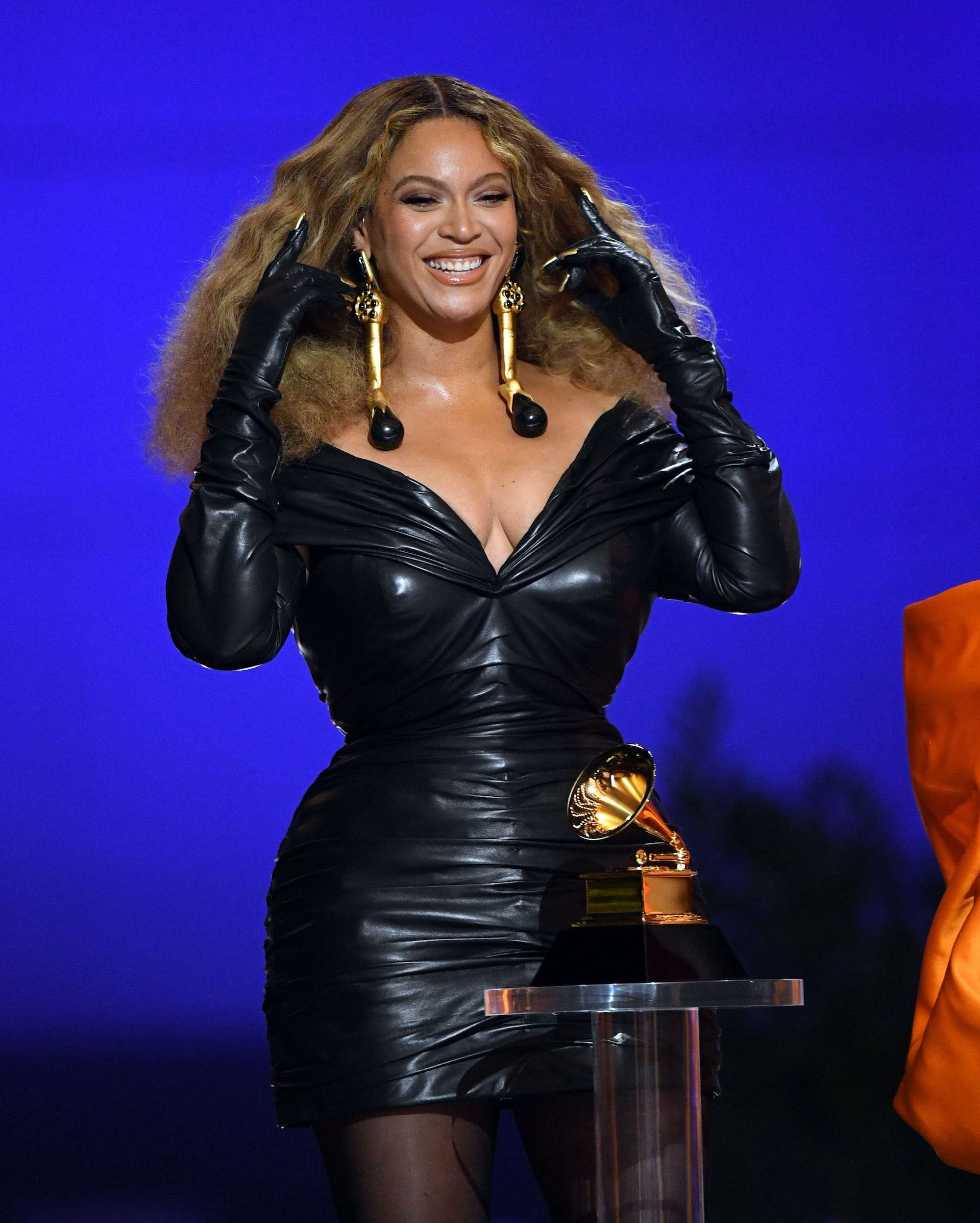 Beyoncé accepted her recordbreaking Grammys wearing a formfitting