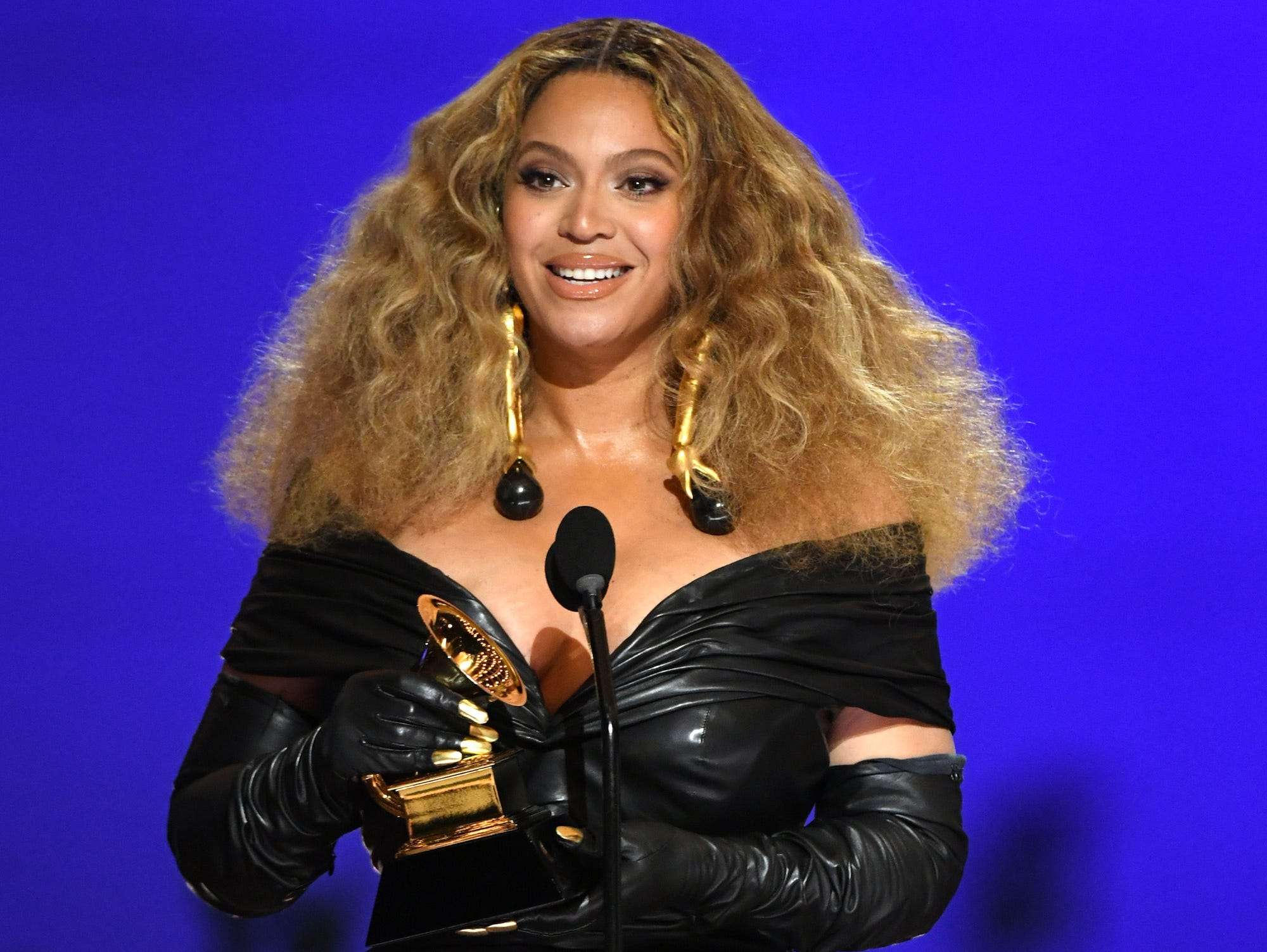 Beyoncé accepted her recordbreaking Grammys wearing a formfitting