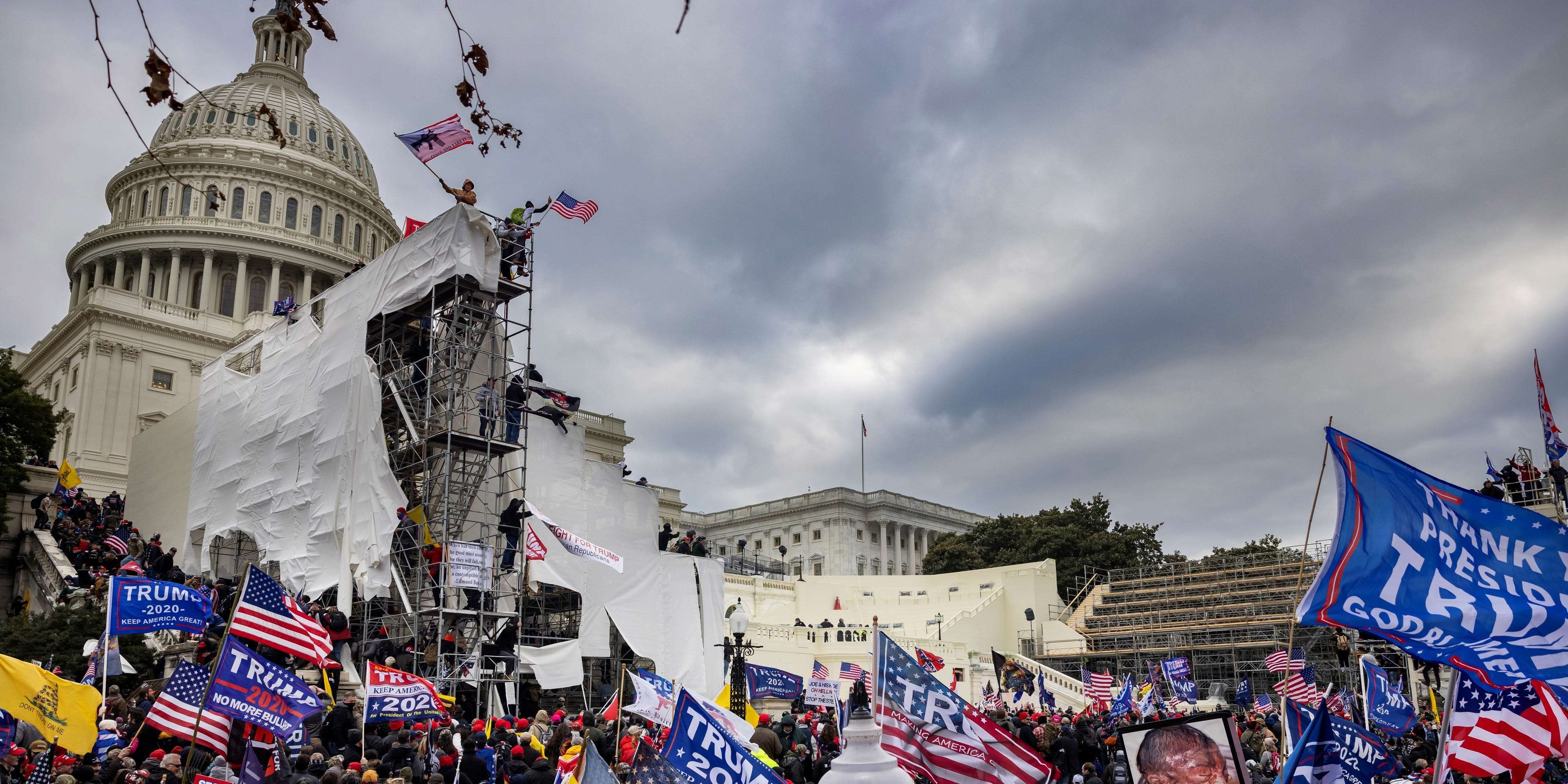 Capitol riot suspect who wore Navy hat and camouflaged shirt during the