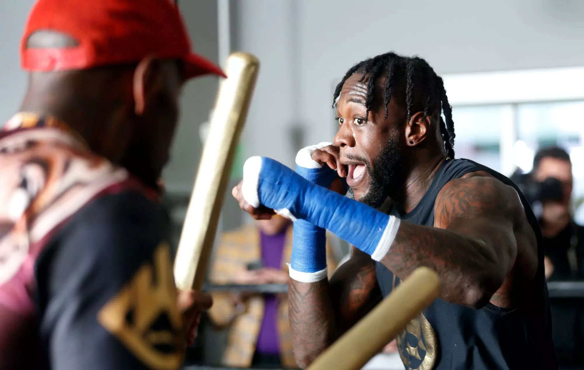 We all know what's up' - Deontay Wilder claims coach Malik Scott WON return  fight despite shock loss to MMA star