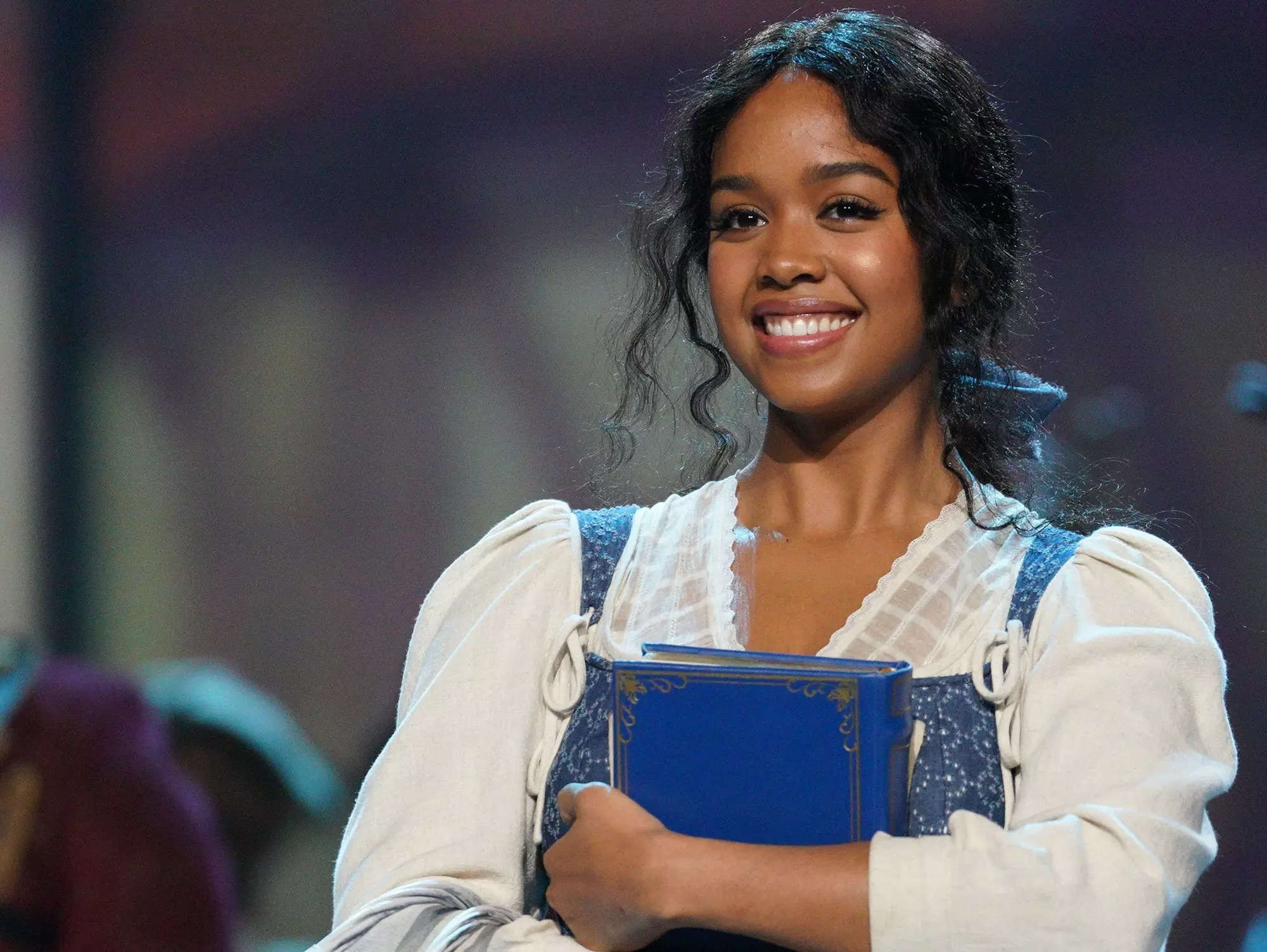 Playing Belle in 'Beauty and the Beast' special helped H.E.R.