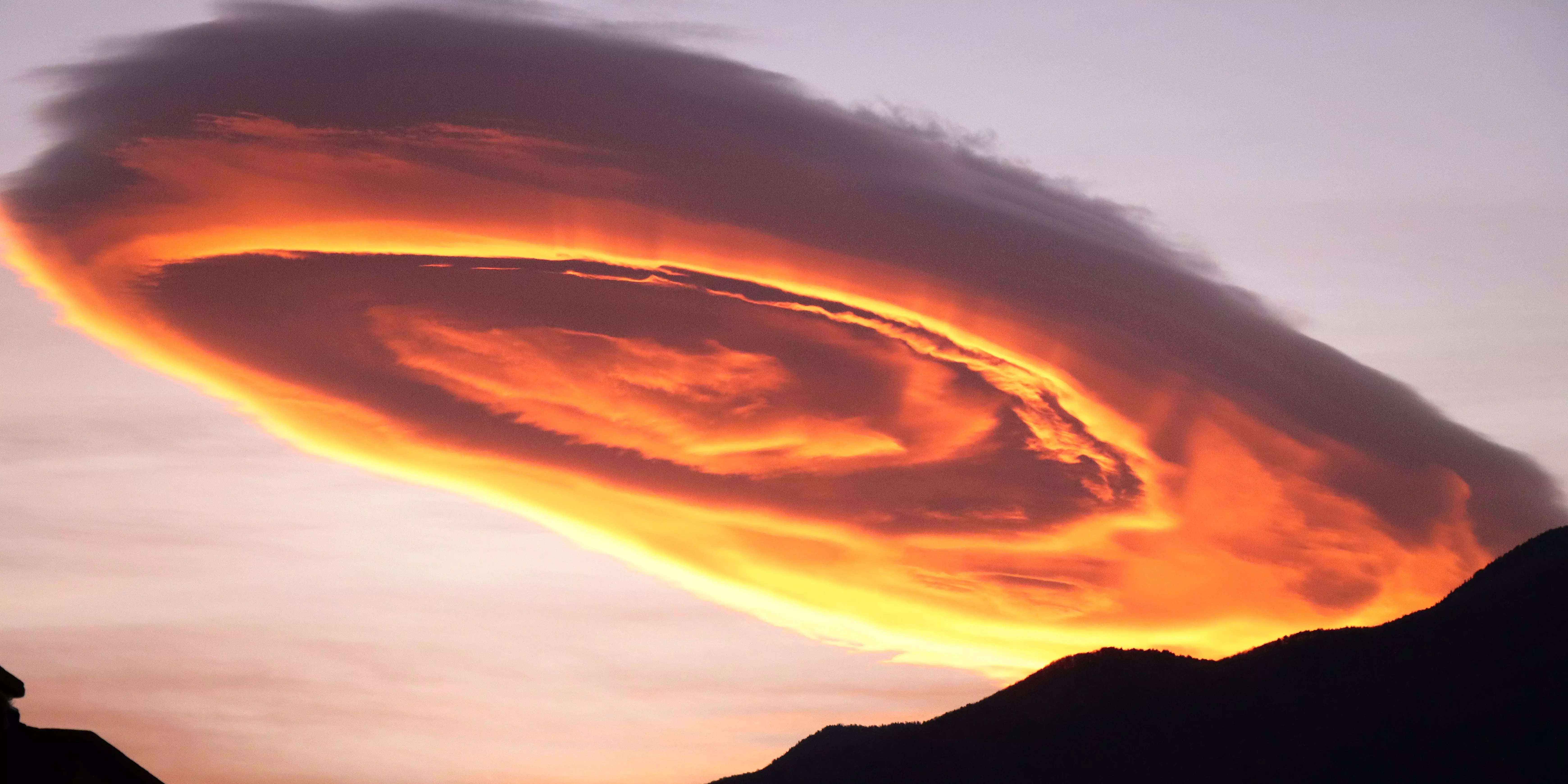 Photos And Videos Show A Glowing, UFO-shaped Cloud Hovering Over A Town ...