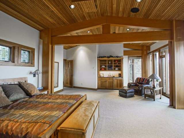 The Master Suite Includes A Large High Ceilinged Bedroom