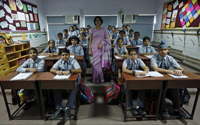 In New Delhi, India, Archana Shori teaches 7th-grade students inside ...