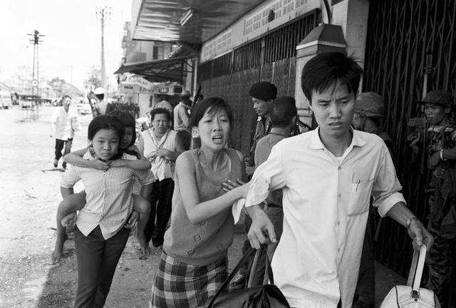 South Vietnamese forces escort suspected Viet Cong officer Nguyen Van ...