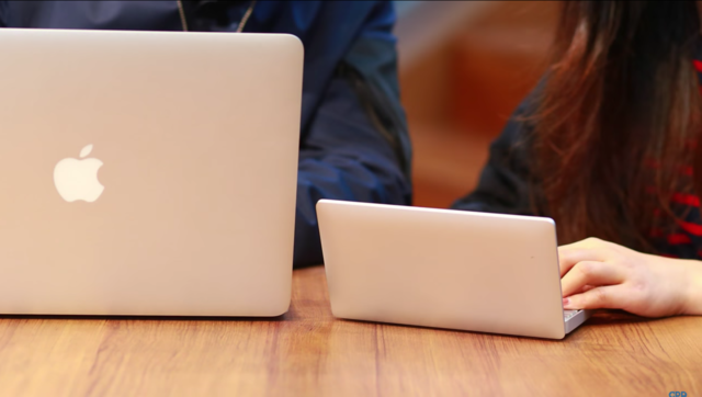 Here it is compared to the MacBook Air. Its shell is aluminum, just like MacBook laptops.