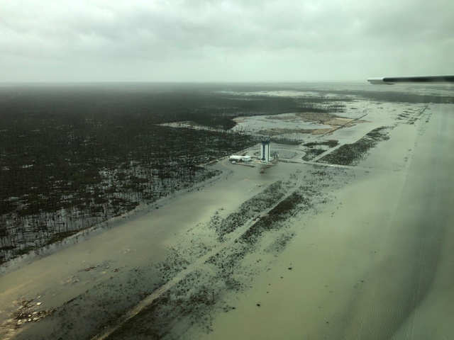 Photos show the mangled airplanes and buildings at Grand Bahama airport ...