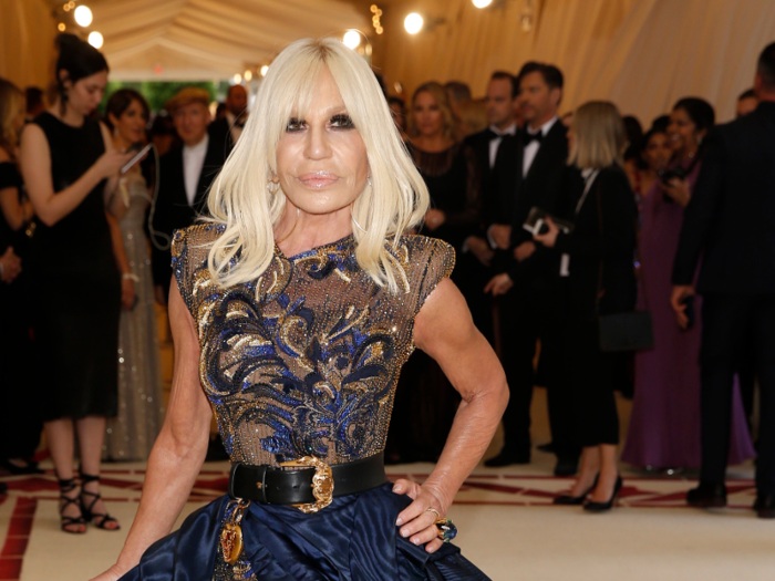 Meet The Two Hidden Billionaires Who Own Michael Kors, Jimmy Choo And Now  Versace