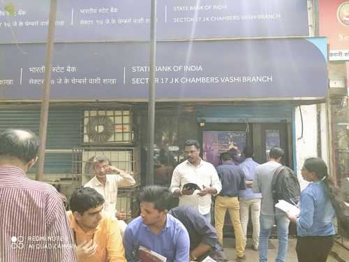 In pics: Customers of Yes Bank line up outside ATMs for cash