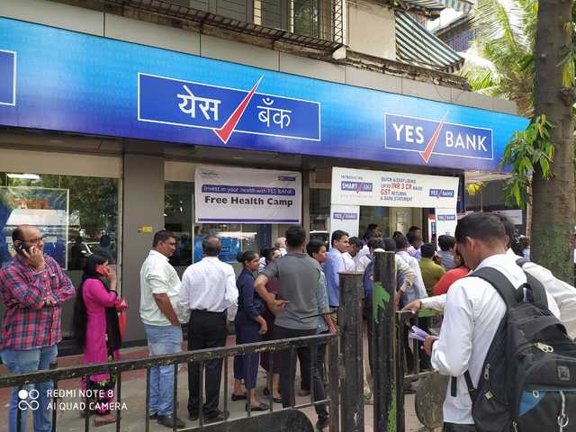 In pics: Customers of Yes Bank line up outside ATMs for cash