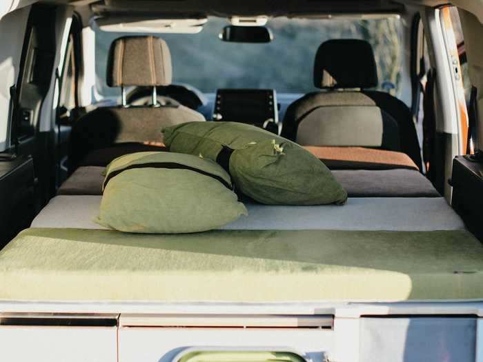 The Camper — which costs up to almost $3,290 — can be used while the second row of seats is up, but when it's bedtime, the trunk and back row can be transformed into a bed that can sleep two.